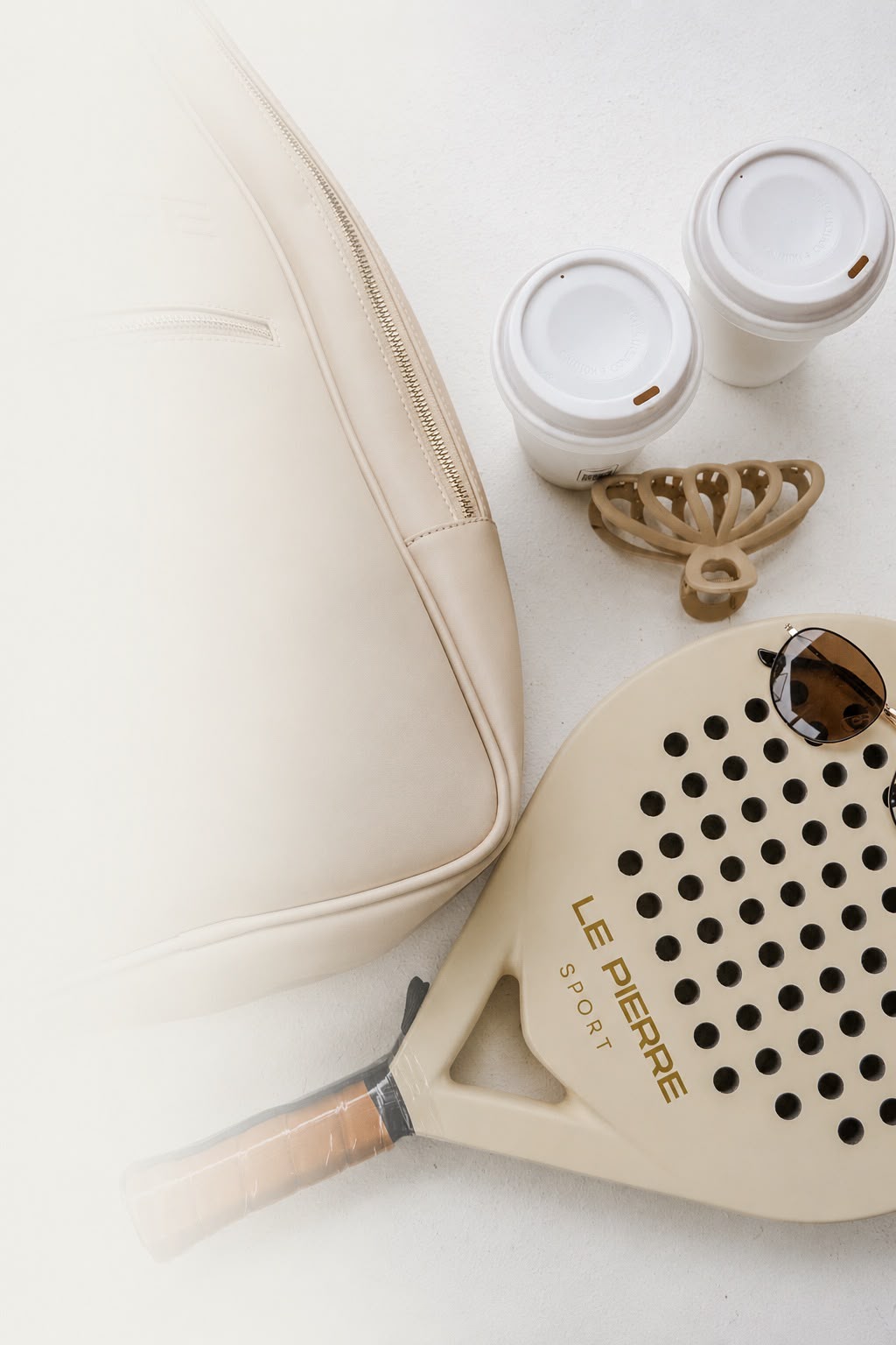 Flatlay with bag, coffee and sunglasses
