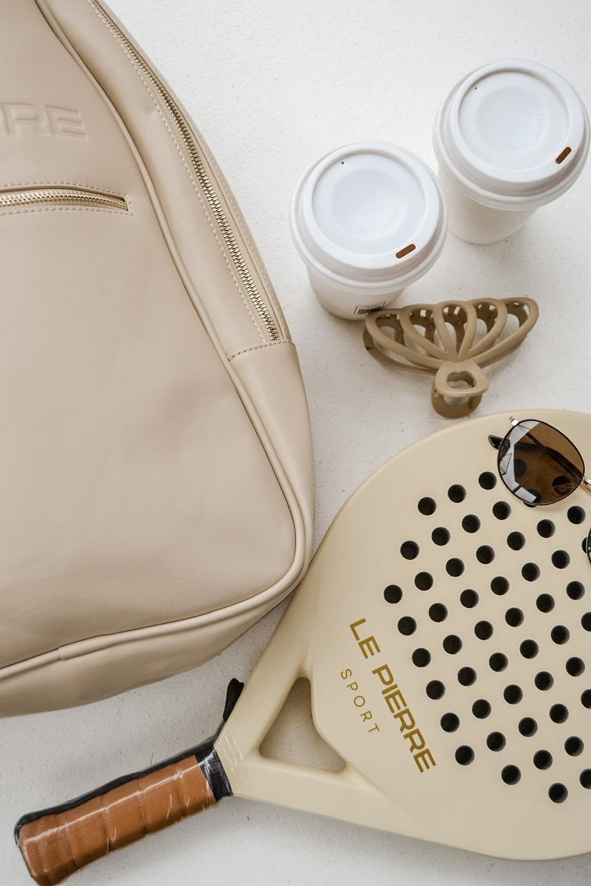 Le Pierre Sport bag, racket, coffee and sunglasses flatlay