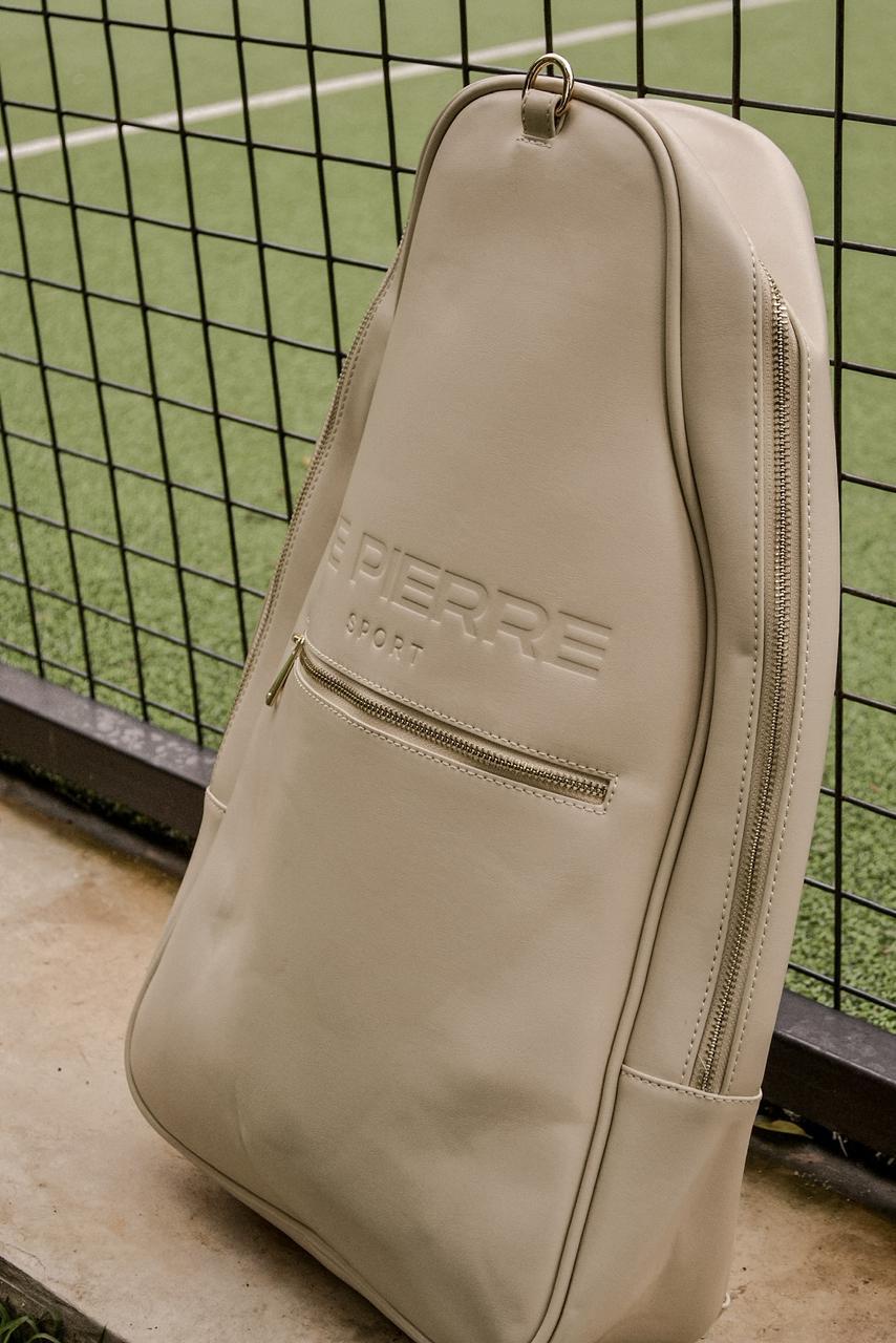 Le Pierre Sport padel bag standing against the court fence
